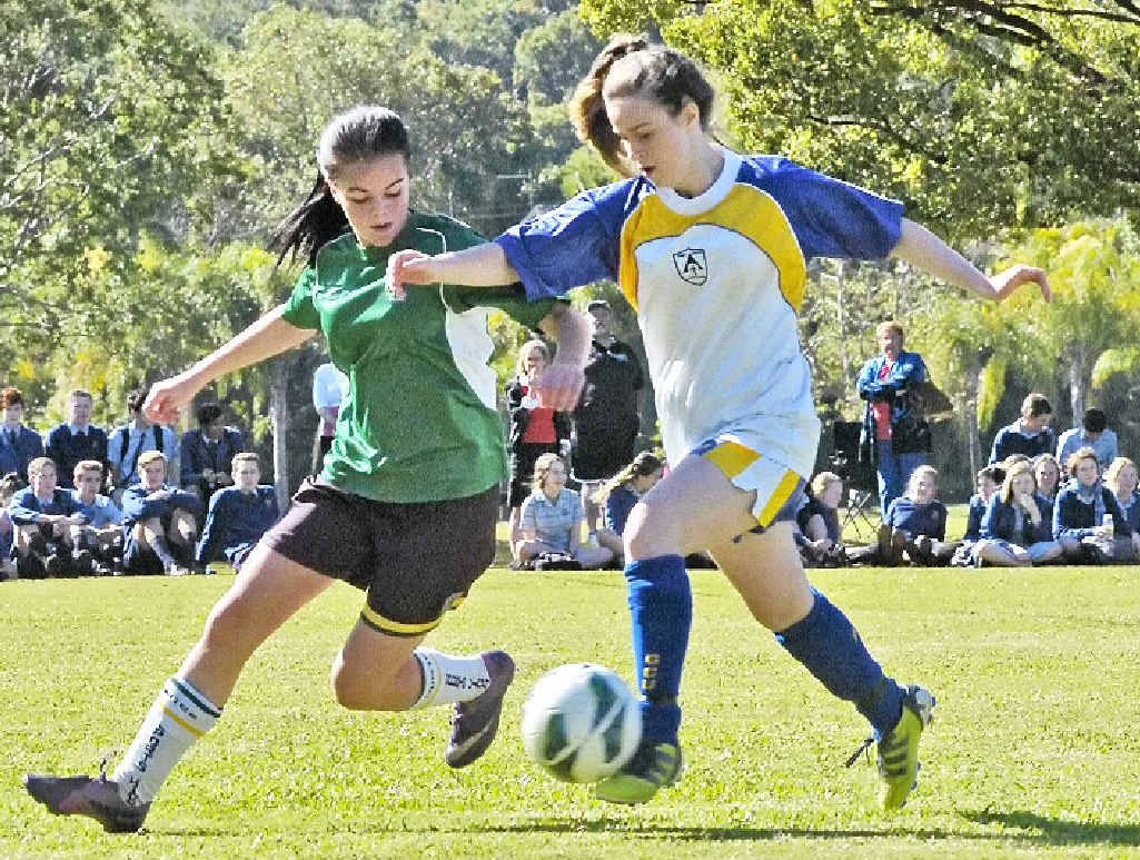ON THE BALL: Trinity Catholic College Lismore’s Lulu Herchenroder (right) challenges Hunter Sports High defender Zoe Jones during the Bill Turner Trophy clash. ON THE BALL: Trinity Catholic College Lismore’s Lulu Herchenroder (right) challenges Hunter Sports High defender Zoe Jones during the Bill Turner Trophy clash.