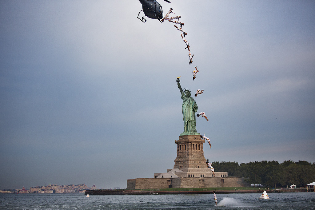 Orlando Duque completes a flying back in front of the Statue of Liberty in New York City, NY, USA on August 19, 2013. Orlando Duque completes a flying back in front of the Statue of Liberty in New York City, NY, USA on August 19, 2013.