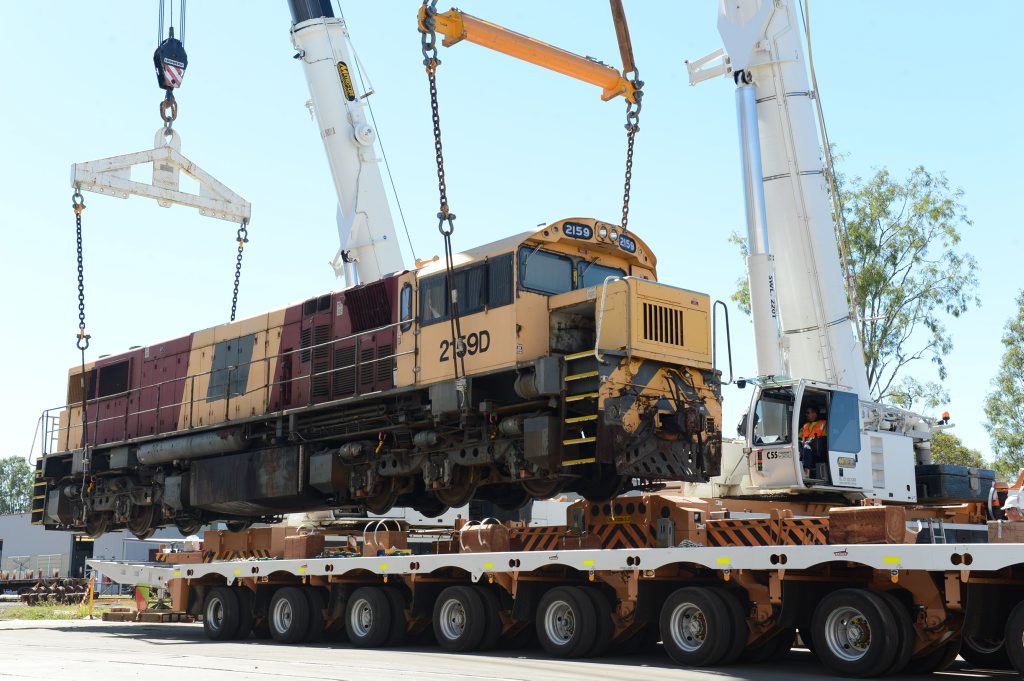 HEAVY GOING: Locomotives at Redbank being transported to the Port of Brisbane after they were sold to a South African company. HEAVY GOING: Locomotives at Redbank being transported to the Port of Brisbane after they were sold to a South African company.