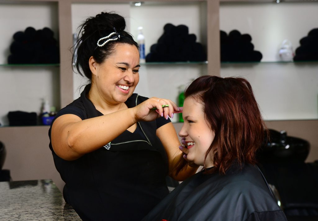 Giggles Hair owner Kristy Midgley loves her job. Pictured with Teneale Bartsch. Giggles Hair owner Kristy Midgley loves her job. Pictured with Teneale Bartsch.