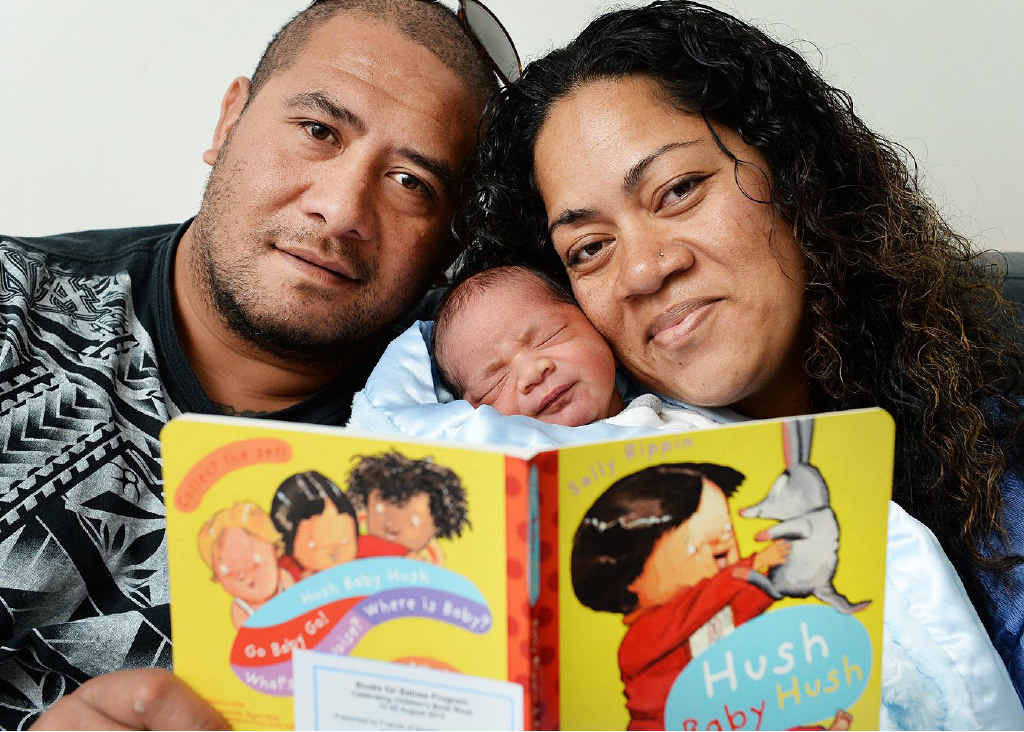 STORY: Johnny and Feofaaki Kavapele read to their new baby Sosefo Maka. STORY: Johnny and Feofaaki Kavapele read to their new baby Sosefo Maka.