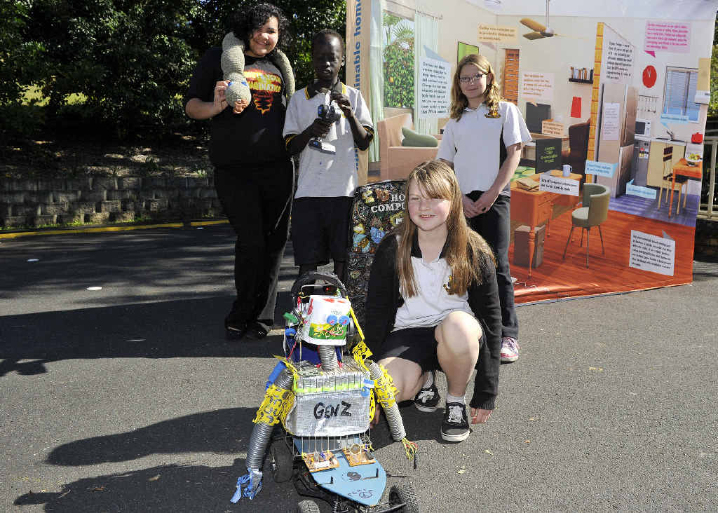 EYING THE ROBOT: At rear Shylene Turner, (Year 12) with Albert Leju, Ashlea Warnke and at front Stephanie Johnson (all in Year 8) with robot GenZ. EYING THE ROBOT: At rear Shylene Turner, (Year 12) with Albert Leju, Ashlea Warnke and at front Stephanie Johnson (all in Year 8) with robot GenZ.