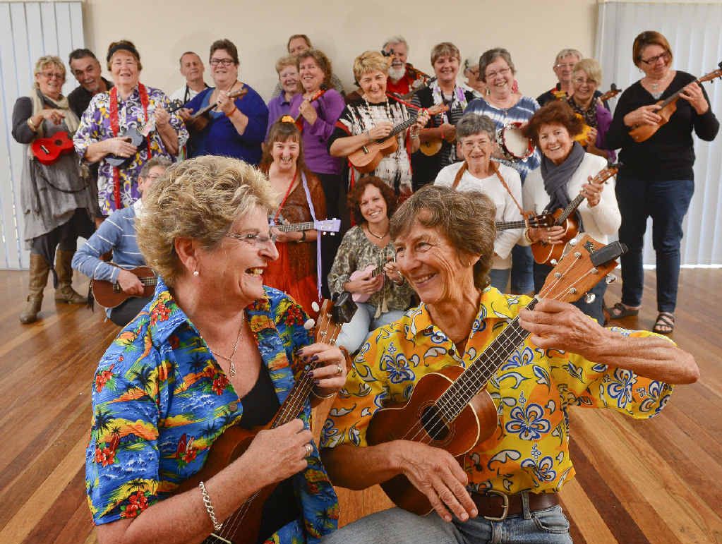 TUNE IN: Madge Little and Jan Taylor strike a pose in front of the Grafton Ukettes at the weekly meeting at Joan Muir Community Hall. Photo: Adam Hourigan