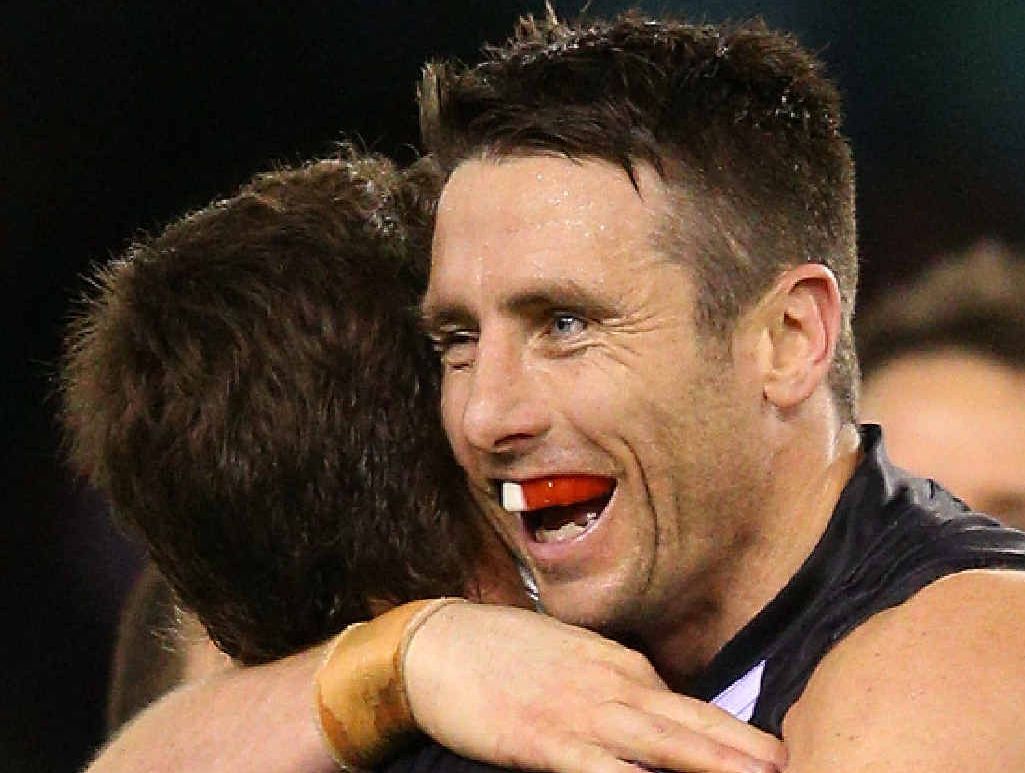 SEEMS LIKE OLD TIMES: Stephen Milne is embraced by Lenny Hayes at Etihad Stadium yesterday. SEEMS LIKE OLD TIMES: Stephen Milne is embraced by Lenny Hayes at Etihad Stadium yesterday.