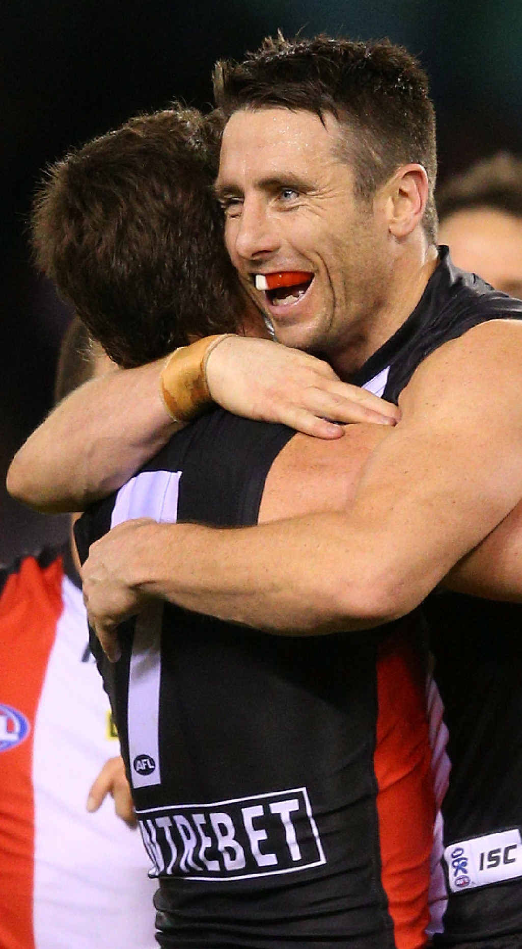 SEEMS LIKE OLD TIMES: Stephen Milne is embraced by Lenny Hayes at Etihad Stadium yesterday. SEEMS LIKE OLD TIMES: Stephen Milne is embraced by Lenny Hayes at Etihad Stadium yesterday.
