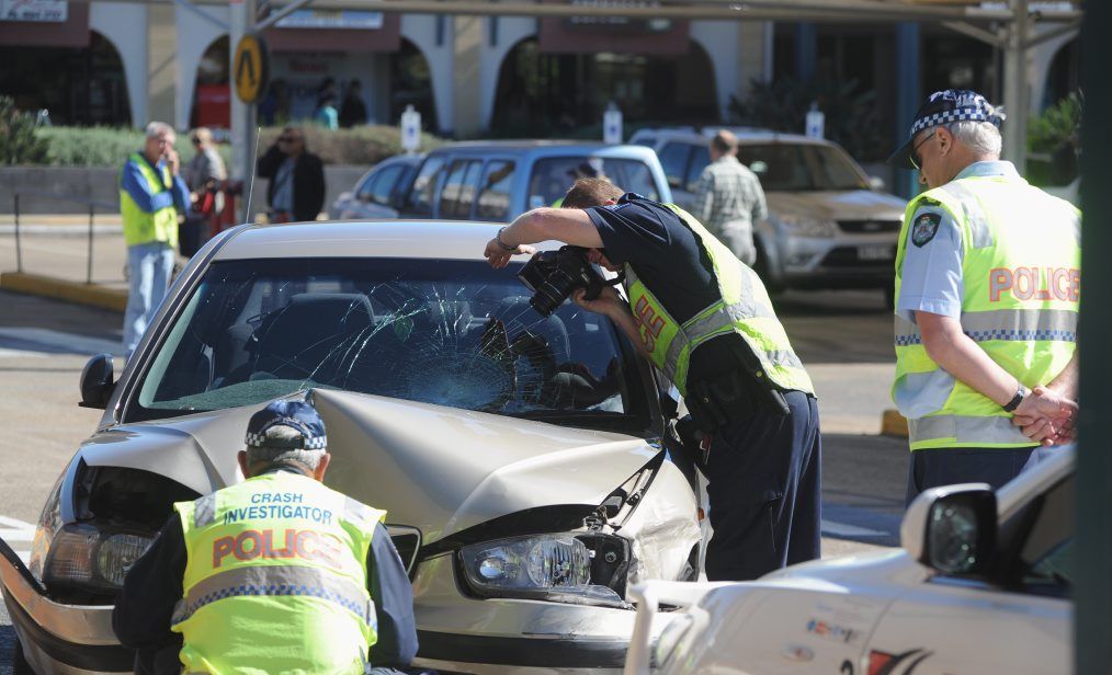Crash scene investigators examine the car involved in the crash at Woolworths in Pialba last year. Crash scene investigators examine the car involved in the crash at Woolworths in Pialba last year.