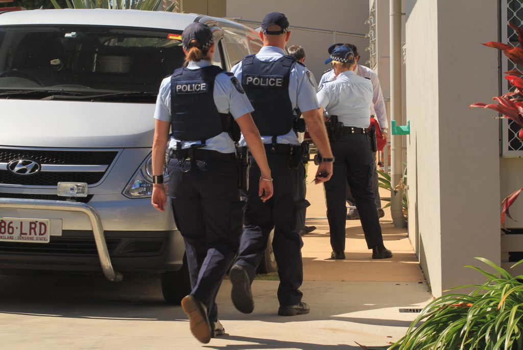 Police officers beside the undertaker's vehicle as the body of a man is removed from the home where he was murdered in the early hours of Tuesday. Police officers beside the undertaker's vehicle as the body of a man is removed from the home where he was murdered in the early hours of Tuesday.