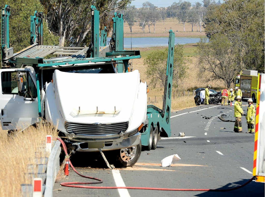 TRAIL OF DESTRUCTION: A truck and car were involved in a fatal head-on collision at Mutdapilly about 500m after Champions Way, Willowbank yesterday. TRAIL OF DESTRUCTION: A truck and car were involved in a fatal head-on collision at Mutdapilly about 500m after Champions Way, Willowbank yesterday.