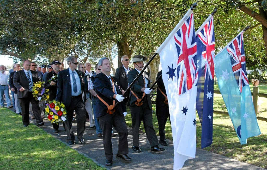 FLYING THE FLAG: THE parade makes it way to the Cenotaph from the RSL. FLYING THE FLAG: THE parade makes it way to the Cenotaph from the RSL.