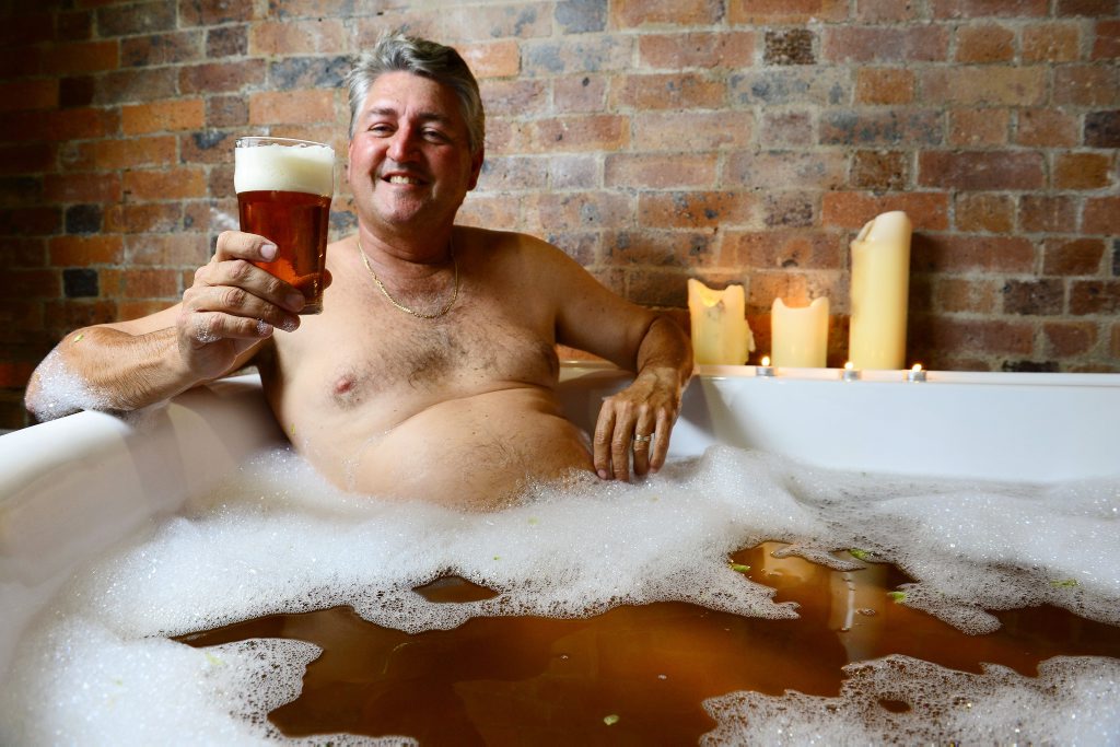 David Glinster enjoys a drink of 4 Hearts Pale Ale and a beer bath at Ipswich Massage and Herbal Spa as part of a special Father’s Day gift offer. David Glinster enjoys a drink of 4 Hearts Pale Ale and a beer bath at Ipswich Massage and Herbal Spa as part of a special Father’s Day gift offer.