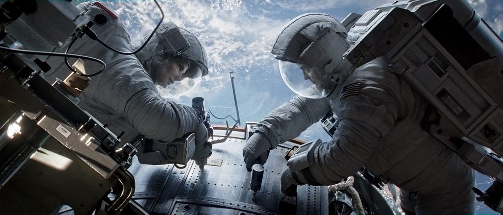 Sandra Bullock and George Clooney in a scene from the movie Gravity. Sandra Bullock and George Clooney in a scene from the movie Gravity.
