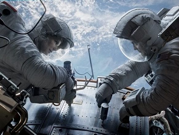 Sandra Bullock and George Clooney in a scene from the movie Gravity. Sandra Bullock and George Clooney in a scene from the movie Gravity.