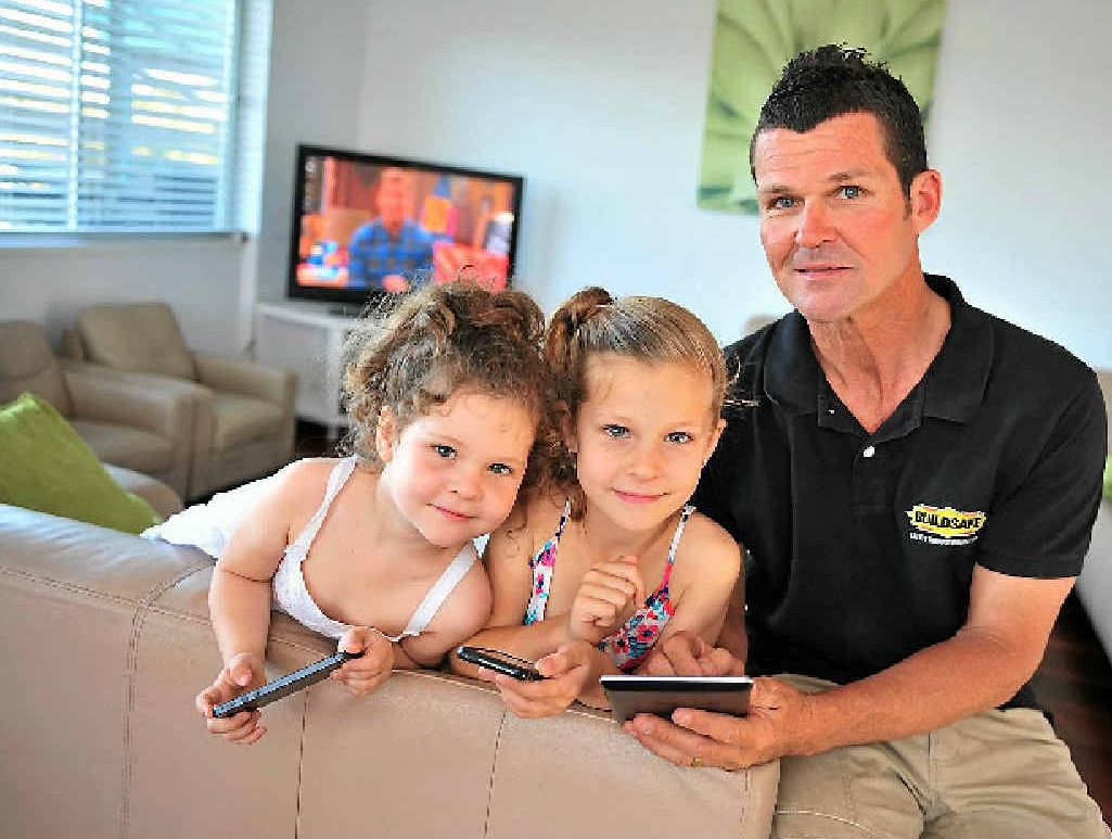 Justin Fisher with daughters Taylah, 7 and Amber, 3 says he relies on technology for his business. Justin Fisher with daughters Taylah, 7 and Amber, 3 says he relies on technology for his business.