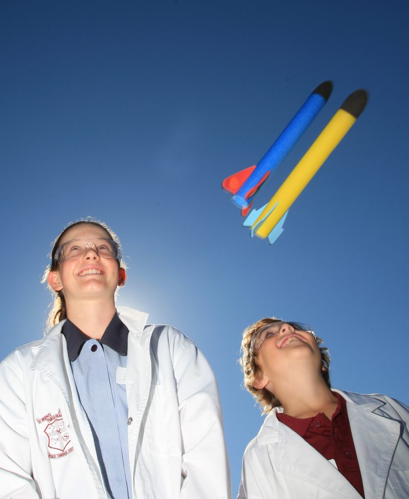 Mt St Patrick student Cecilia Ryan and St Joseph's student Connor Robinson watch as their rocket experiments take flight. 