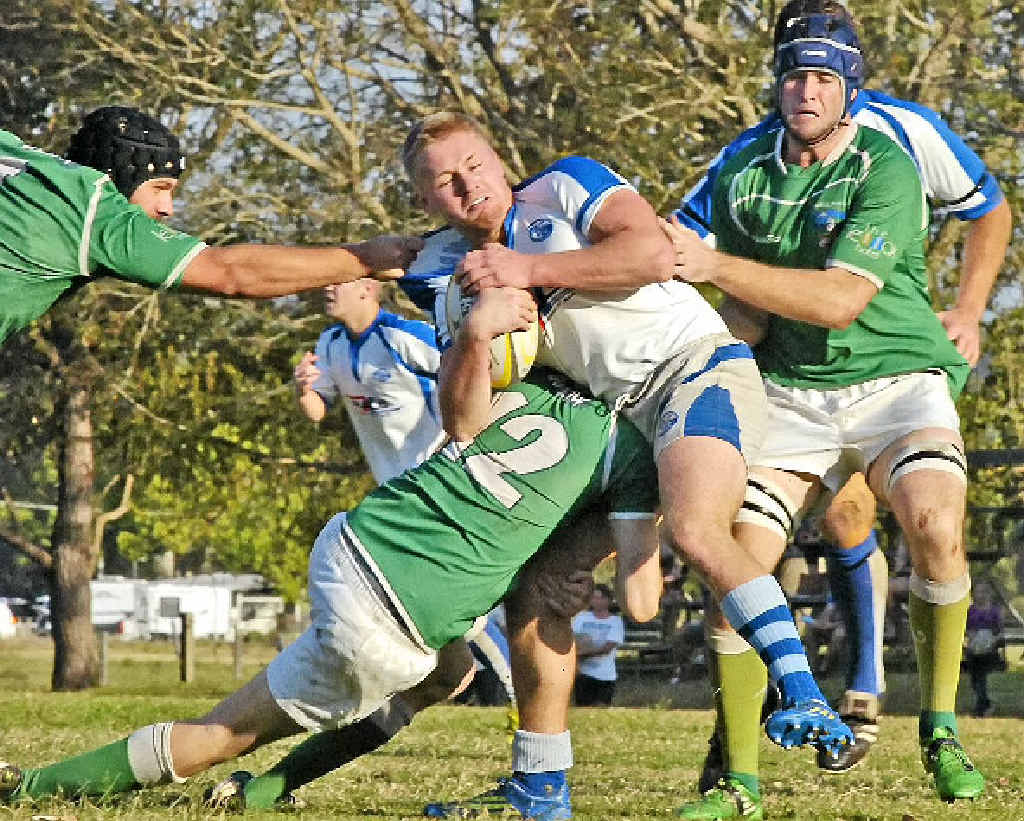 HEAVY TRAFFIC: Byron Bay’s Harry Nuttall finds his way blocked by Lennox Head Trojans’ backline during the minor semi-final. HEAVY TRAFFIC: Byron Bay’s Harry Nuttall finds his way blocked by Lennox Head Trojans’ backline during the minor semi-final.