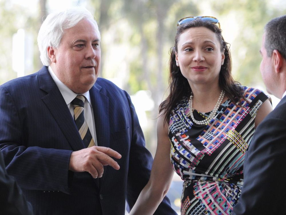 Leader of the Palmer United Party, Clive Palmer with his wife Anna speaking with former candidate Michael Tudman at the Hervey Bay Airport. Leader of the Palmer United Party, Clive Palmer with his wife Anna speaking with former candidate Michael Tudman at the Hervey Bay Airport.