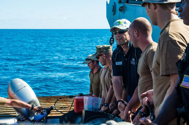 Explosive Ordnance Disposal Mobile Unit sailors with Great Barrier Reef Marine Park Authority advisor Michael Phelan conduct a simulation phase of the jettisoned ordnance recovery in the Great Barrier Reef Marine Park. Explosive Ordnance Disposal Mobile Unit sailors with Great Barrier Reef Marine Park Authority advisor Michael Phelan conduct a simulation phase of the jettisoned ordnance recovery in the Great Barrier Reef Marine Park.