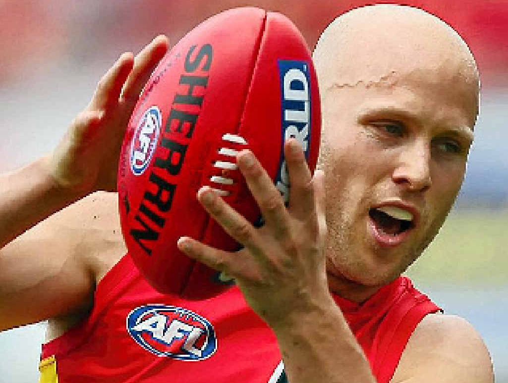 CHAMPION EFFORT: Gary Ablett of the Gold Coast Suns takes a mark yesterday during the victory over the Greater Western Sydney Giants, coached by Kevin Sheedy (inset).