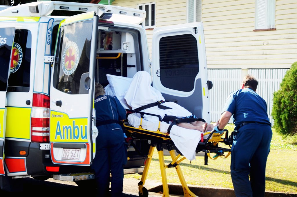 Ambulance officers load an injured man into an ambulance before taking him to Maryborough Base Hospital. Ambulance officers load an injured man into an ambulance before taking him to Maryborough Base Hospital.
