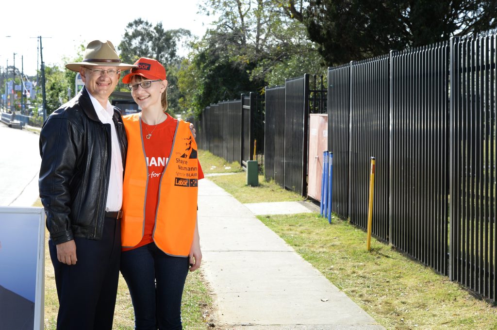 Shayne Neumann campaigning with his daughter Jacqui outside Bundamba State School on Wednesday. Photo: Shayne Neumann campaigning with his daughter Jacqui outside Bundamba State School on Wednesday. Photo: