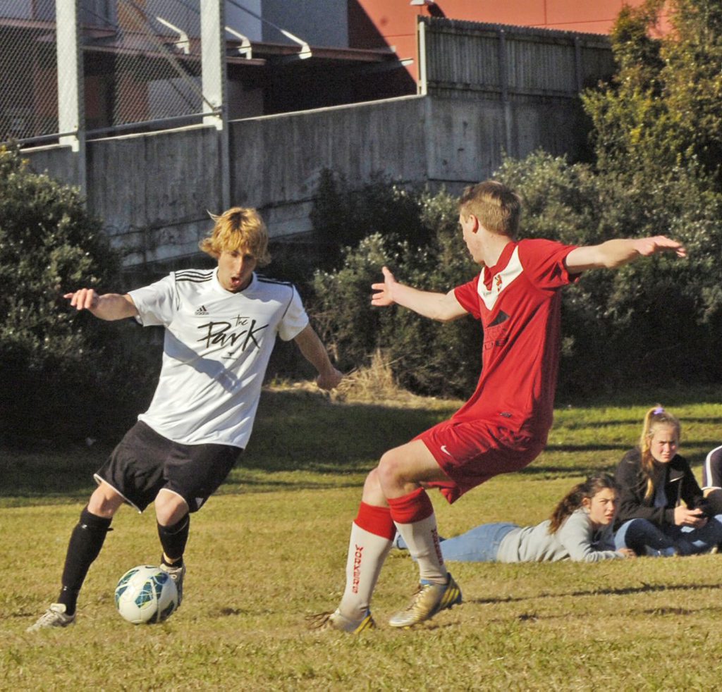 Marauding Byron Bay Rams full-back Jonathan Pierce (left) takes on Lismore Workers defender Jamie Hill during the men's premier division clash. Photo Stuart Turner / The Northern Star Marauding Byron Bay Rams full-back Jonathan Pierce (left) takes on Lismore Workers defender Jamie Hill during the men's premier division clash. Photo Stuart Turner / The Northern Star