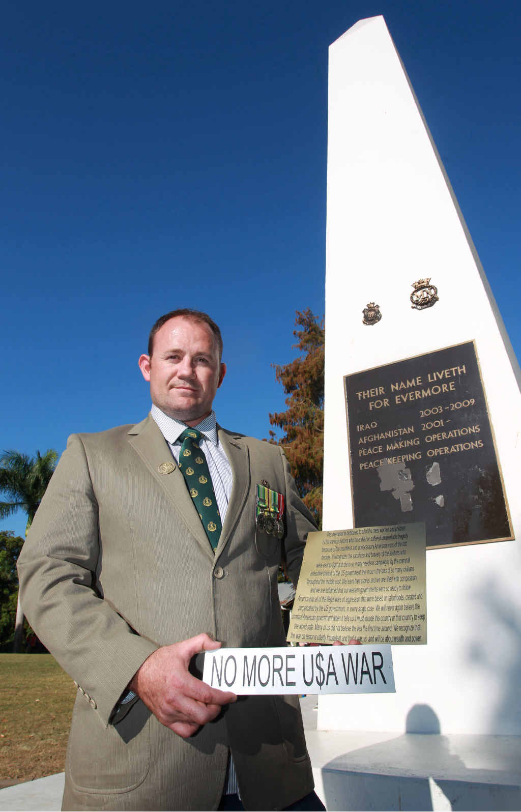 NO RESPECT: Returned Iraq and East Timor veteran, Ben Millmann, is disgusted that somebody stuck an anti-war plaque on the Nambour cenotaph. NO RESPECT: Returned Iraq and East Timor veteran, Ben Millmann, is disgusted that somebody stuck an anti-war plaque on the Nambour cenotaph.