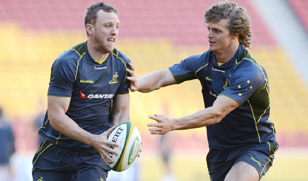 NERVOUS TIMES: Wallabies players Nick Cummins (right) and Jesse Mogg during the team’s Captain’s Run yesterday at Suncorp Stadium in Brisbane. NERVOUS TIMES: Wallabies players Nick Cummins (right) and Jesse Mogg during the team’s Captain’s Run yesterday at Suncorp Stadium in Brisbane.