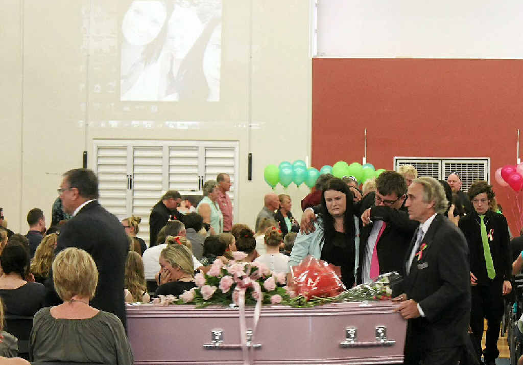 LAST JOURNEY: Family members and friends of Jessica and Rheanna Schobbe mourn as pallbearers take their coffins to the hearse. INSET: Family and friends embrace each other at Jessica and Schobbe’s funeral as they bid farewell to the Yeppoon sisters. LAST JOURNEY: Family members and friends of Jessica and Rheanna Schobbe mourn as pallbearers take their coffins to the hearse. INSET: Family and friends embrace each other at Jessica and Schobbe’s funeral as they bid farewell to the Yeppoon sisters.