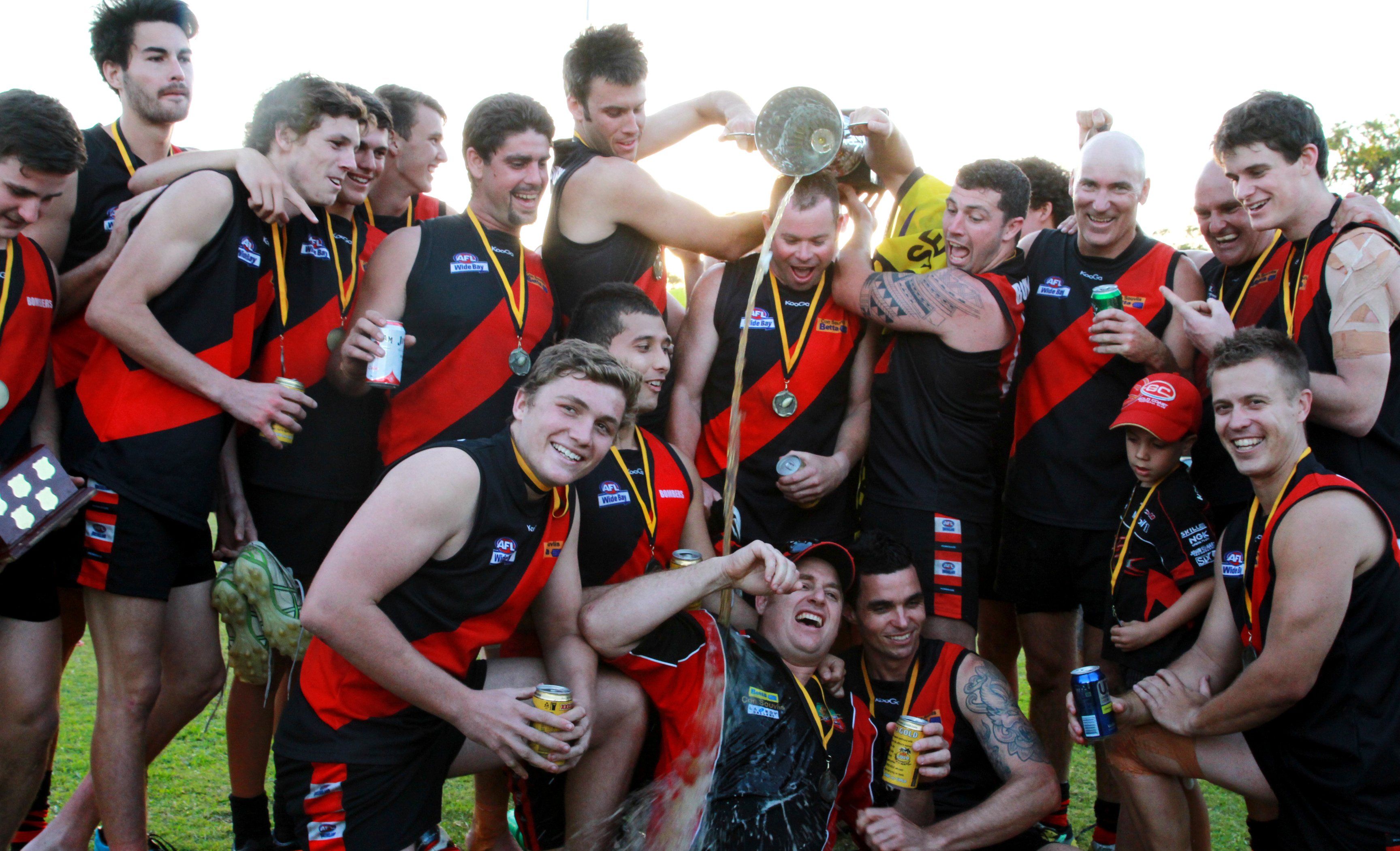 The triumphant Bombers celebrate their grand final win. The triumphant Bombers celebrate their grand final win.