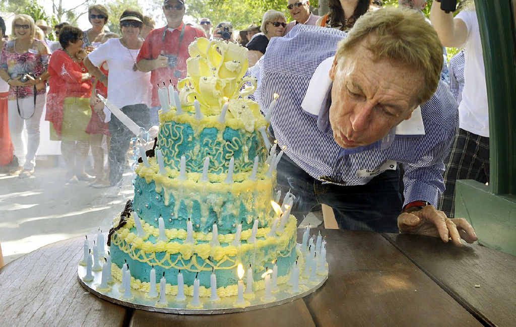 BIG BREATH: Well-known real estate business owner Garth Llewellyn blows out the 80 candles on his birthday cake. BIG BREATH: Well-known real estate business owner Garth Llewellyn blows out the 80 candles on his birthday cake.