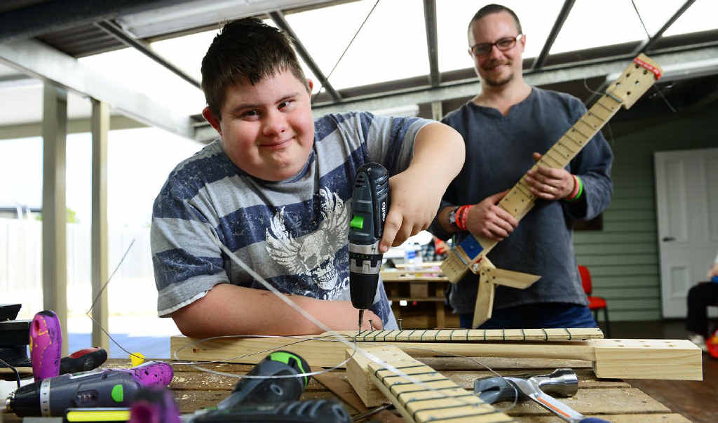 JAM SESSION: Jarred Owers (left) learns how to build his own electric guitar when Nye Stewart from JAM visited Luke’s Place. JAM SESSION: Jarred Owers (left) learns how to build his own electric guitar when Nye Stewart from JAM visited Luke’s Place.
