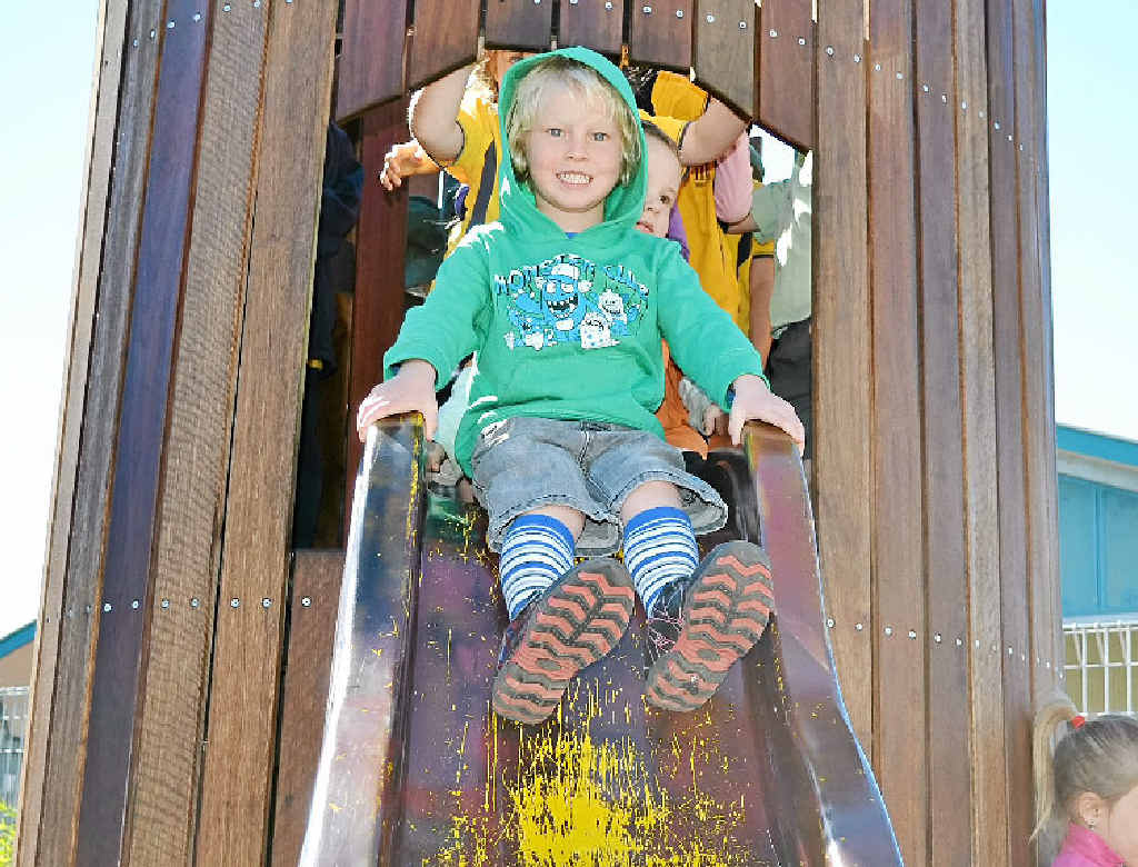 LOTS OF FUN: Zane Rays, 5, tries out the slide at the opening of the Woodburn Preschool playspace area. LOTS OF FUN: Zane Rays, 5, tries out the slide at the opening of the Woodburn Preschool playspace area.