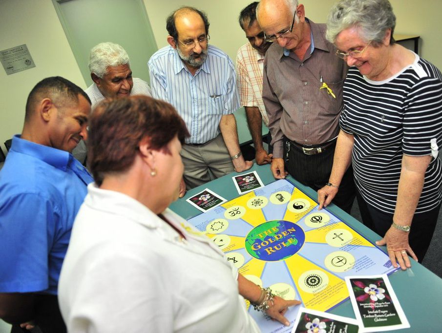 (L-R) Maxine Brushe, Luis Arroyo, Richard Johnson, John Abood, Duane Johnson, Ren Lanzon and Sr Beryl Amedee meet to organise Day of Peace at the Botanic Gardens. 