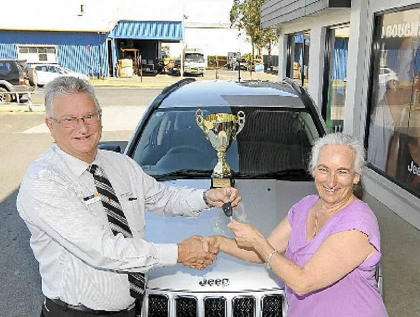 GOOD SPORT: Karl Meir of Northern Rivers Chrysler Dodge Jeep presents Julie Cowan with the keys to a brand new Jeep Compass Sport. GOOD SPORT: Karl Meir of Northern Rivers Chrysler Dodge Jeep presents Julie Cowan with the keys to a brand new Jeep Compass Sport.
