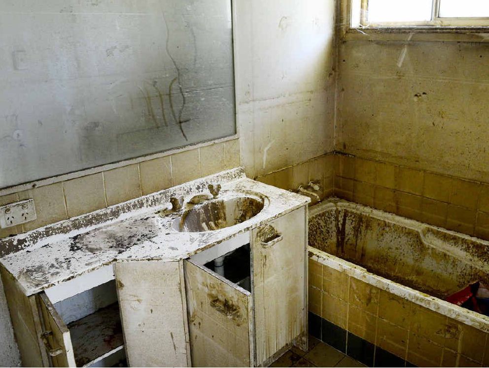 THIS bathroom in Hillsdon Court appear not have been touched since it was abandoned after the 2011 floods. THIS bathroom in Hillsdon Court appear not have been touched since it was abandoned after the 2011 floods.