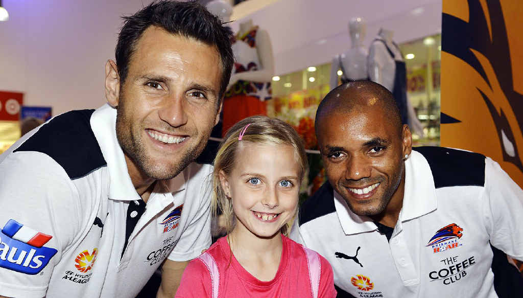 FAN: Krystal Brown, 8, with Brisbane Roar players Michael Theo and Henrique de Andrade at Riverlink Shopping Centre. FAN: Krystal Brown, 8, with Brisbane Roar players Michael Theo and Henrique de Andrade at Riverlink Shopping Centre.