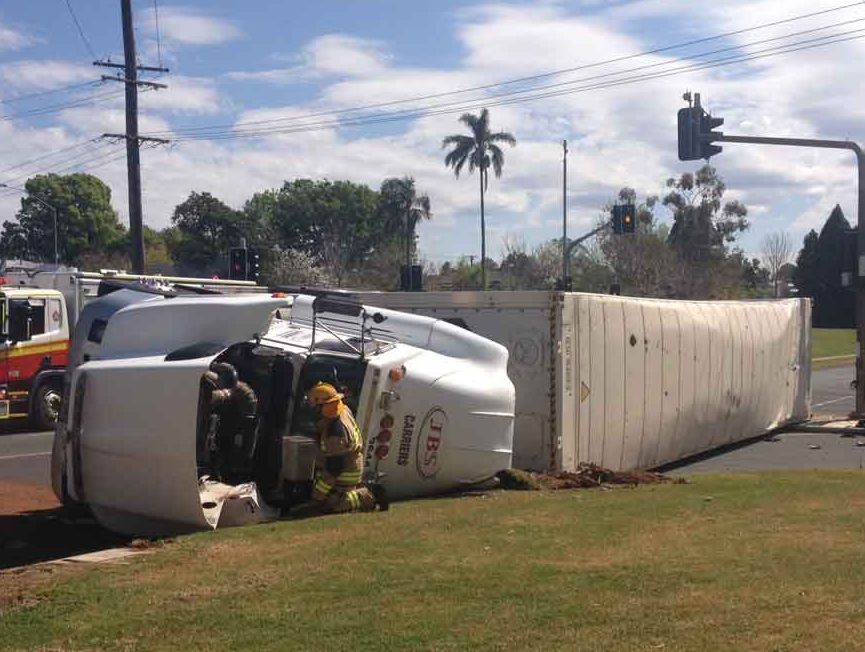 Emergency services at the scene of this morning's truck rollover at the intersection of Bridge and Tor Sts, Toowoomba. Emergency services at the scene of this morning's truck rollover at the intersection of Bridge and Tor Sts, Toowoomba.