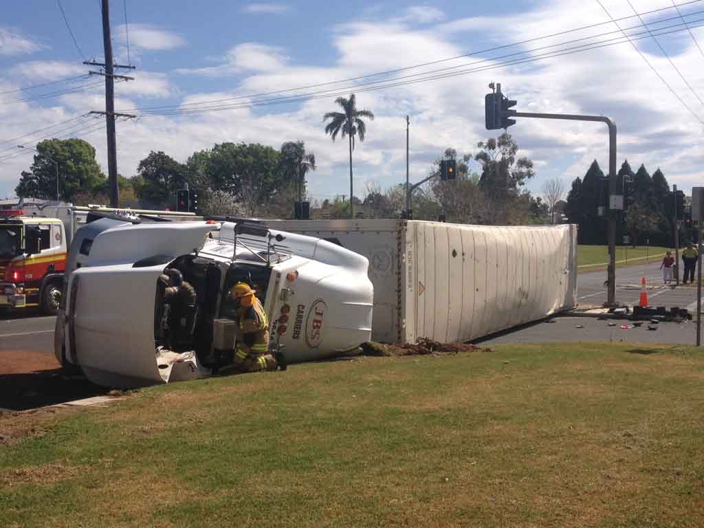 Emergency services at the scene of this morning's truck rollover at the intersection of Bridge and Tor Sts, Toowoomba. Emergency services at the scene of this morning's truck rollover at the intersection of Bridge and Tor Sts, Toowoomba.
