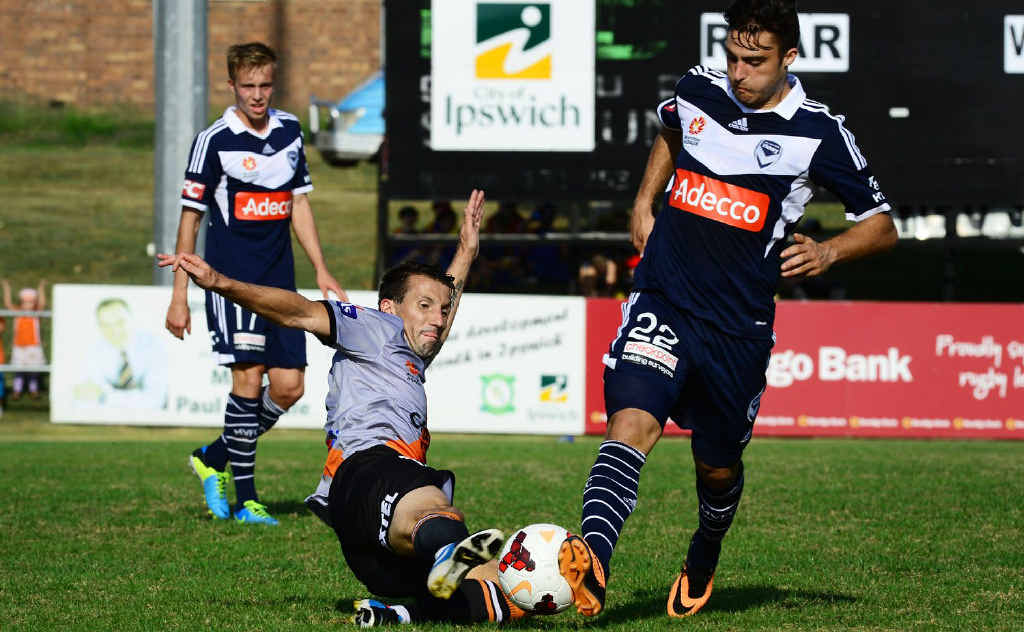 FIELD UNDER FIRE: Action during the A-League pre-season football match at North Ipswich Reserve. FIELD UNDER FIRE: Action during the A-League pre-season football match at North Ipswich Reserve.