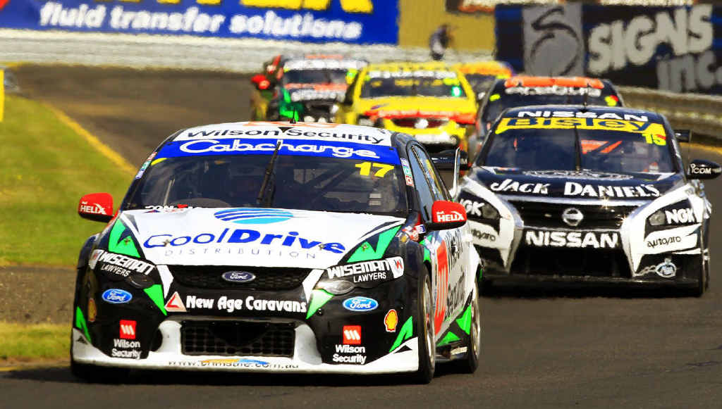 Ash Walsh in action with the V8 Supercars. Ash Walsh in action with the V8 Supercars.