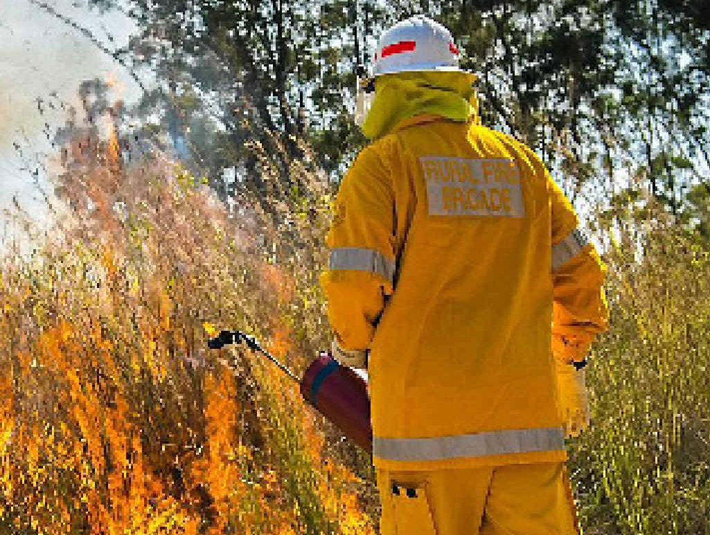 Lance Clulee of the Benaraby Rural Fire Brigade carries out backburning operations near the Boyne Island-Benaraby roundabout on Sunday. Lance Clulee of the Benaraby Rural Fire Brigade carries out backburning operations near the Boyne Island-Benaraby roundabout on Sunday.