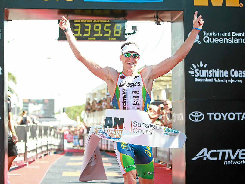 HOW SWEET IT IS: A delighted Peter Jacobs wins the inaugural Ironman 70.3 Sunshine Coast at Mooloolaba yesterday.