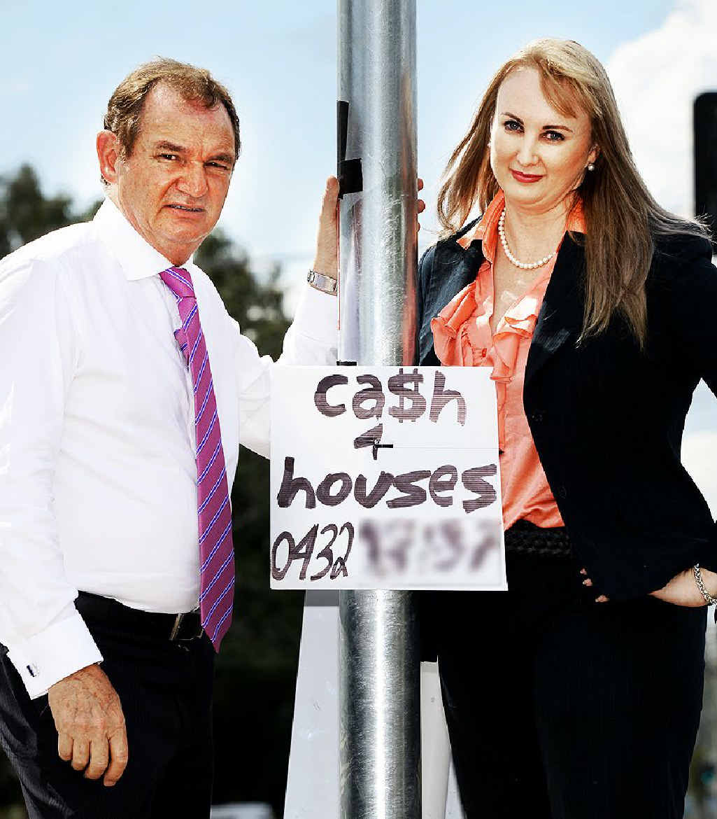 “SHANTY TOWN”: Ipswich mayor Paul Pisasale and Cr Cheryl Bromage with one of the illegal signs that are littering Ipswich streets. “SHANTY TOWN”: Ipswich mayor Paul Pisasale and Cr Cheryl Bromage with one of the illegal signs that are littering Ipswich streets.