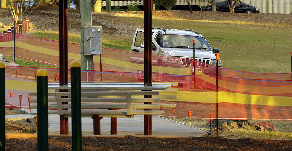 STAY BACK: A SECUREcorp guard keeps watch over a wet concrete slab in Reals Park, Sadliers Crossing. STAY BACK: A SECUREcorp guard keeps watch over a wet concrete slab in Reals Park, Sadliers Crossing.