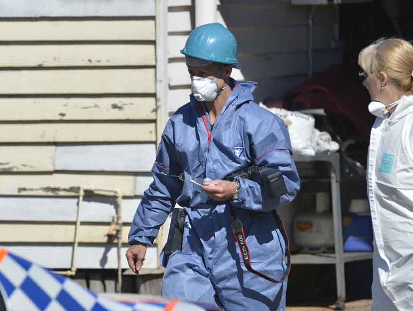 Fire investigators at the scene of a fatal house fire in North Toowoomba. Fire investigators at the scene of a fatal house fire in North Toowoomba.