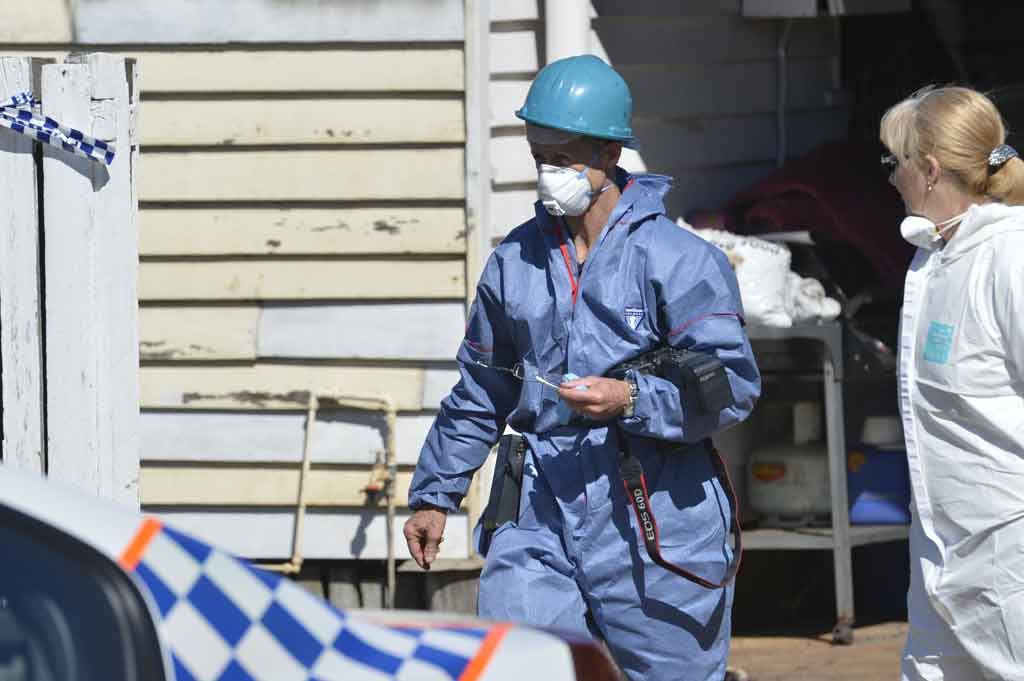 Fire investigators at the scene of a fatal house fire in North Toowoomba. Fire investigators at the scene of a fatal house fire in North Toowoomba.