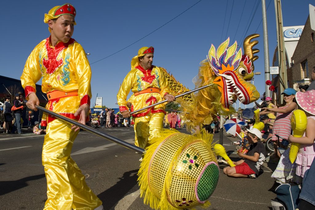 A sea of colour makes it way down Ruthven St for the Carnival of Flowers floral parade.