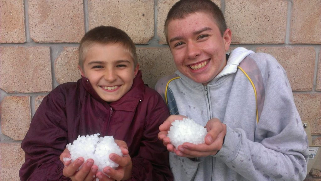 School holiday-makers Luka Roll, 11, and his brother Hayden, 17, from Sippy Downs with handfuls of hailstones that fell in Burum Heads. School holiday-makers Luka Roll, 11, and his brother Hayden, 17, from Sippy Downs with handfuls of hailstones that fell in Burum Heads.