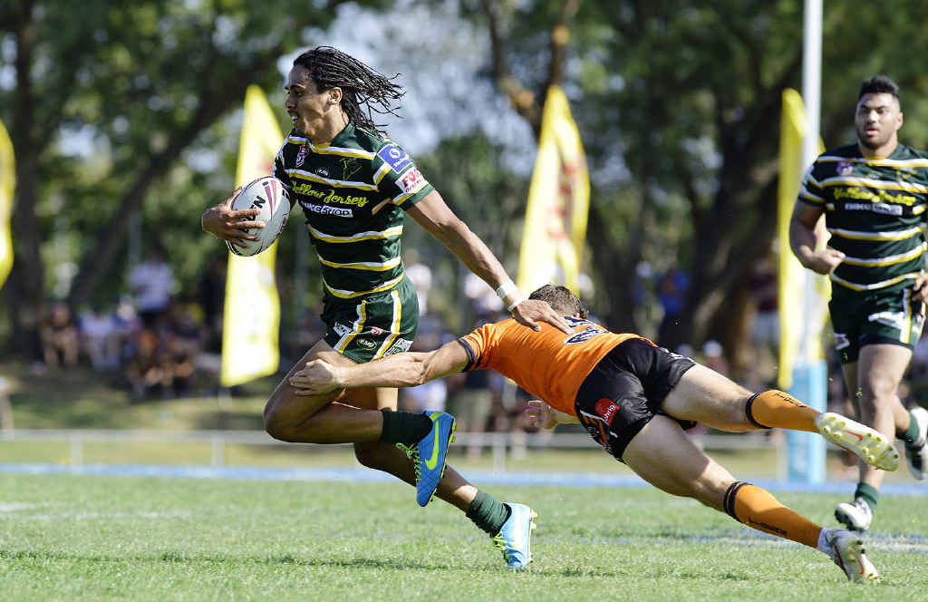 STANDOUT EFFORT: Athletic Ipswich Jets winger Khan Ahwang tries to shake the Easts tackler during yesterday’s FOGS Cup grand final at the North Ipswich Reserve. Below: Mahe Paseka makes a strong run during the Jets’ second half resurgence. STANDOUT EFFORT: Athletic Ipswich Jets winger Khan Ahwang tries to shake the Easts tackler during yesterday’s FOGS Cup grand final at the North Ipswich Reserve. Below: Mahe Paseka makes a strong run during the Jets’ second half resurgence.