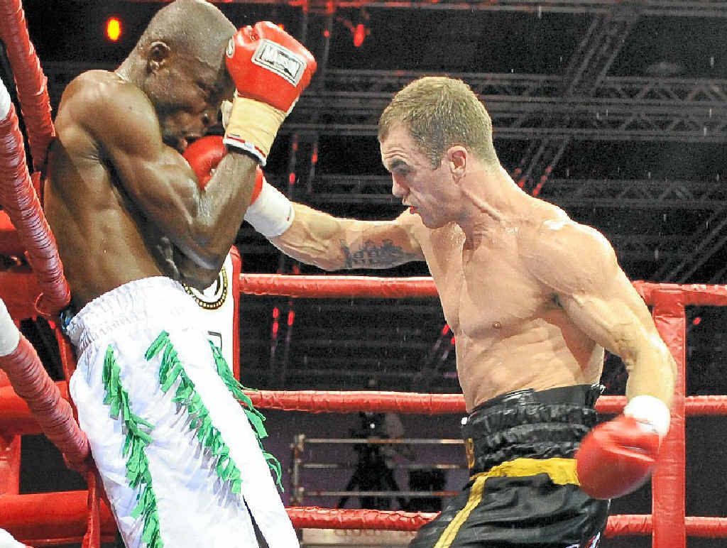Australian boxer Jarrod Fletcher lands a big hit on Ghanaian Philip Kotey during their fight in May. Australian boxer Jarrod Fletcher lands a big hit on Ghanaian Philip Kotey during their fight in May.